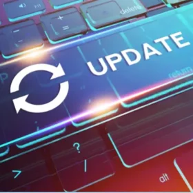 A glowing digital "UPDATE" button with a refresh icon over a futuristic keyboard, symbolizing software or system updates.